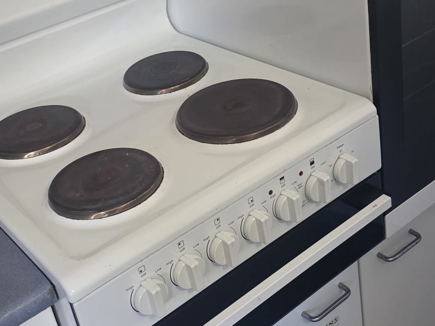 Spotless white electric stovetop and oven