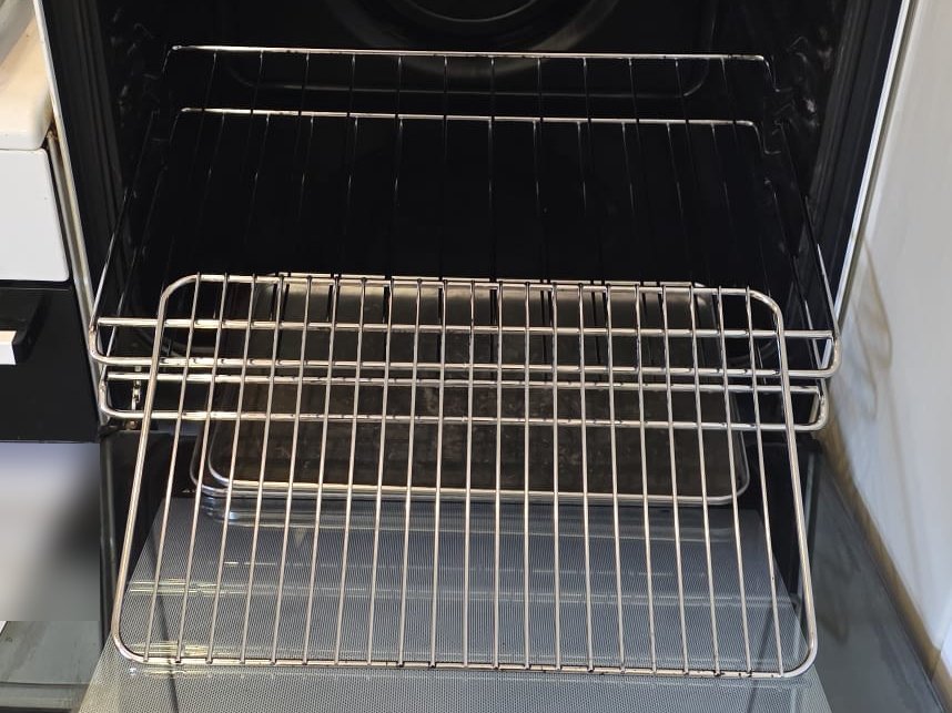 Oven racks and interior gleaming after a deep clean